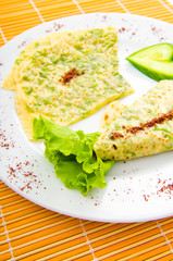 Pancake with herbs in the plate