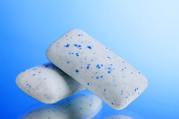 chewing gums on blue background