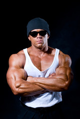 Fototapeta na wymiar strong athletic man in dark glasses