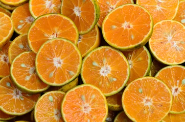 Foto op Canvas Verse sinaasappelvruchten plakjes achtergrond © suthiwat