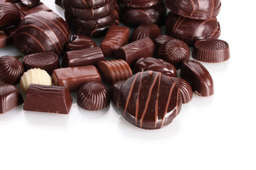 Many different chocolate candy isolated on white