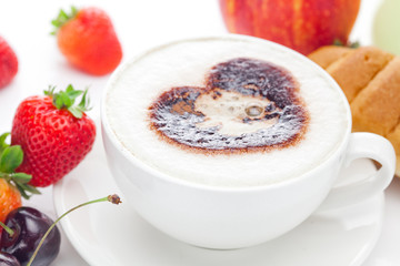 cappuccino in a cup in the shape of hearts,cherry,croissant  and