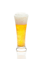light beer with the foam in a tall glass isolated on white