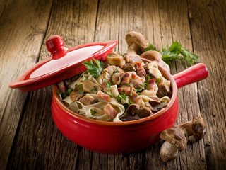 tagliatelle with cep edible mushroom and bacon over casserole