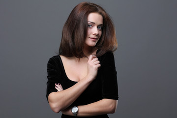 Beautiful young woman in grey background