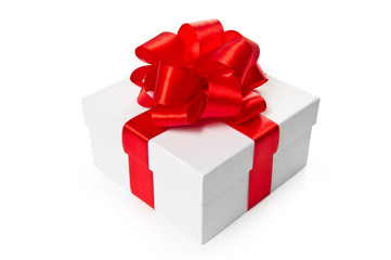 White gift box with red satin bow and ribbon