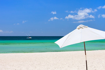 Fototapeta na wymiar White beach umbrella