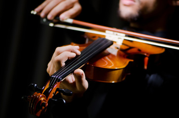 Young violin player playing