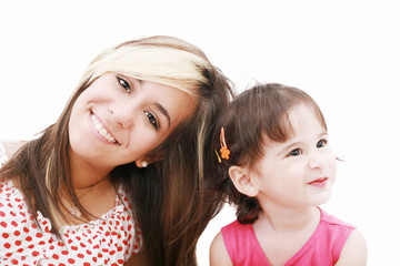 Teen sister and baby sister.  Cute sisters portrait, close up, i