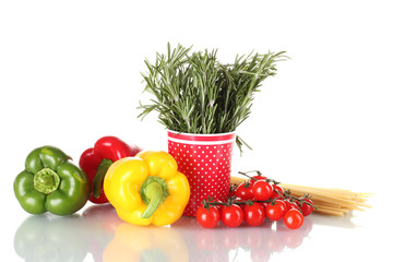 fresh green rosemary in red cup, paprika, tomatoes and spaghetti