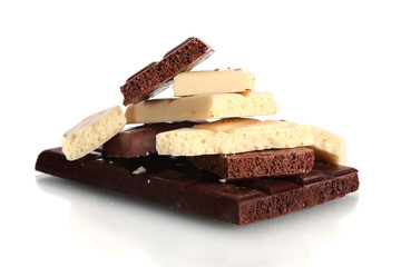 Slices of milk and white chocolate bar isolated on white