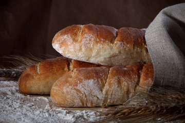 three fresh baguettes on table