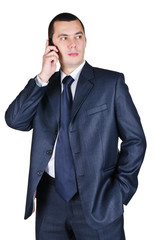 Portrait of the young businessman speaking by phone