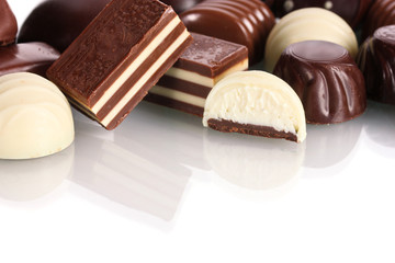 Many different chocolate candy isolated on white