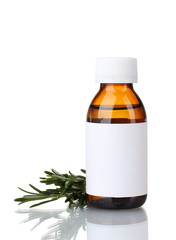 medical bottle and fresh green rosemary isolated on white
