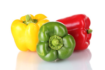 fresh green, red and yellow paprika isolated on white