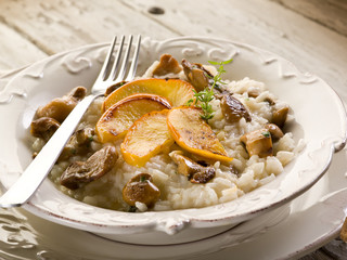 Risotto with apple and cep edible mushroom