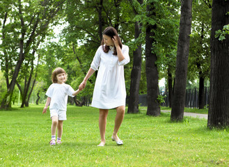 Fototapeta premium Portrait of mother with daughter outdoor