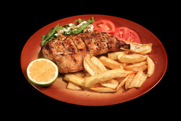 grilled chicken breast served on a plate