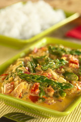 Green asparagus curry with rice in the back