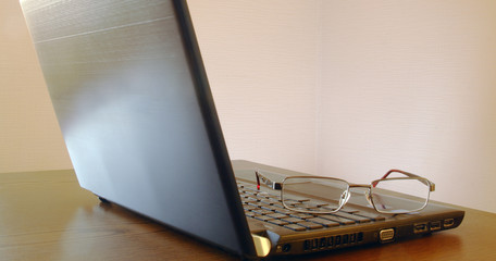 Glasses on the laptop.