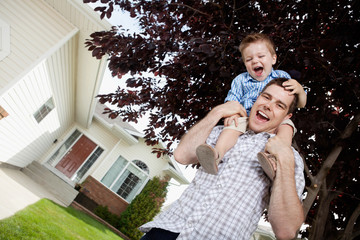 Father with Toddler Son on Shoulders