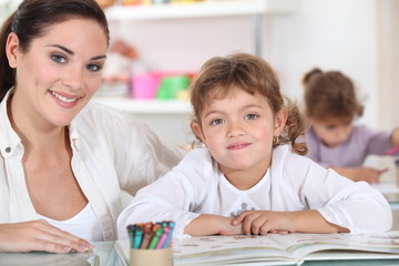 Little girls drawing in class