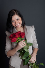 girl with a bouquet of red roses