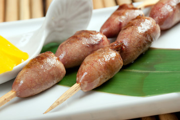 Grilled chicken hearts on skewers