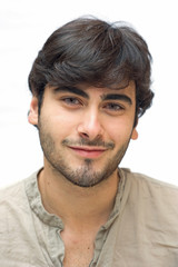 Fototapeta premium Happy casual man smiling over white background.