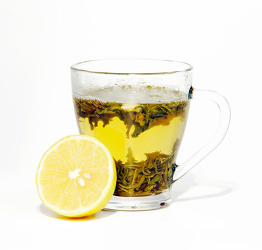 tea in cup and lemon isolated on white background