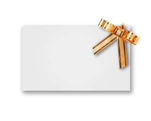 blank postcard tied with a bow of golden ribbon