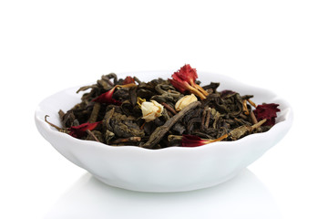 Fototapeta na wymiar Green dry tea leaves in plate isolated on white