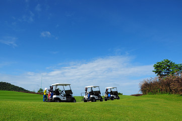 Golf Carts under beautiful sky