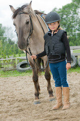 Little jockey - girl and horse ranch