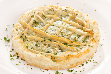 tasty quiche with cheese and herbs