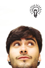 Happy casual man looking up having an idea.