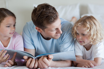 Father reading with his children