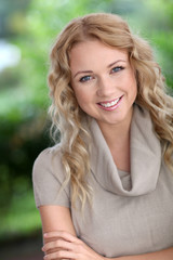 Fototapeta premium Portrait of cheerful attractive woman