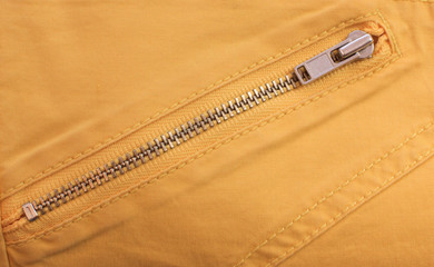 close up of zip on the yellow clothes © stockphoto mania