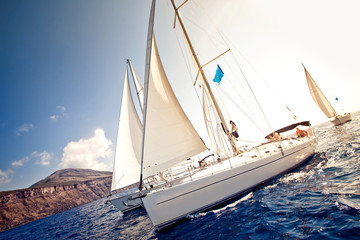 Sailing ship yachts with white sails