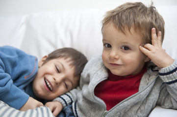 Two brothers on sofa.