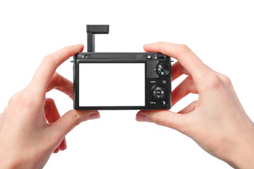 Closeup image of two hands black compact digital photo camera wi