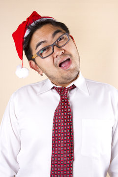 Hi Santa!, Businessman wear red hat and glasses smiling.