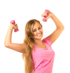 Beautiful smiling girl with free weights in gym