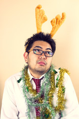 Thinking Reindeer, Businessman with reindeer horn act thinking.