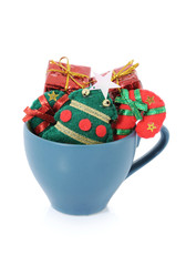 Christmas knick knacks neatly arranged in a cup