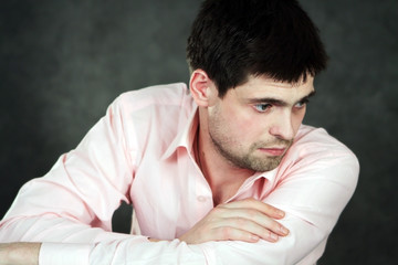 Young man in pink shirt