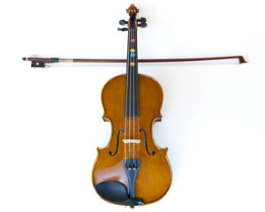 Fototapeta premium wooden children violin, fiddle and stick making a cross