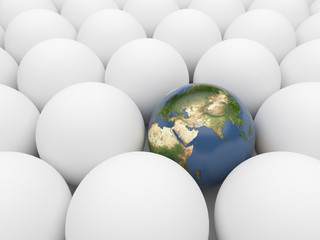 Earth sphere  among white spheres. Unique planet. 3D illustratio